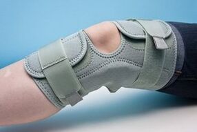 Knee orthosis to fix an arthritic joint